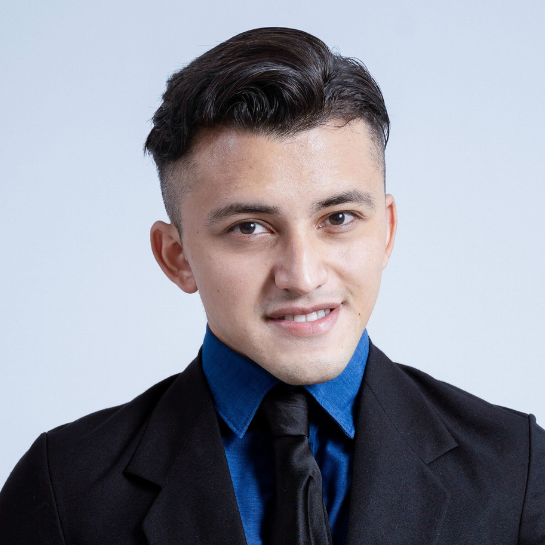 Jhanier Professional headshot of Jhanier Cardoza, Client Relationship Manager at Stelmakh & Associates, wearing a black suit, blue shirt, and black tie, with a confident smile.